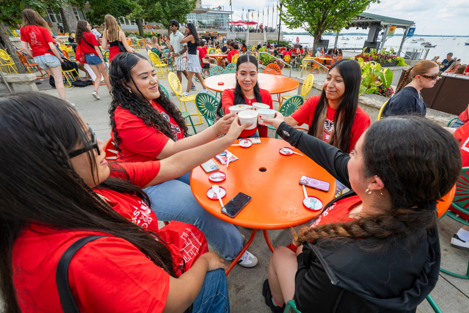 New first-year undergraduate students toast with their ice cream at the Memorial Union Terrace