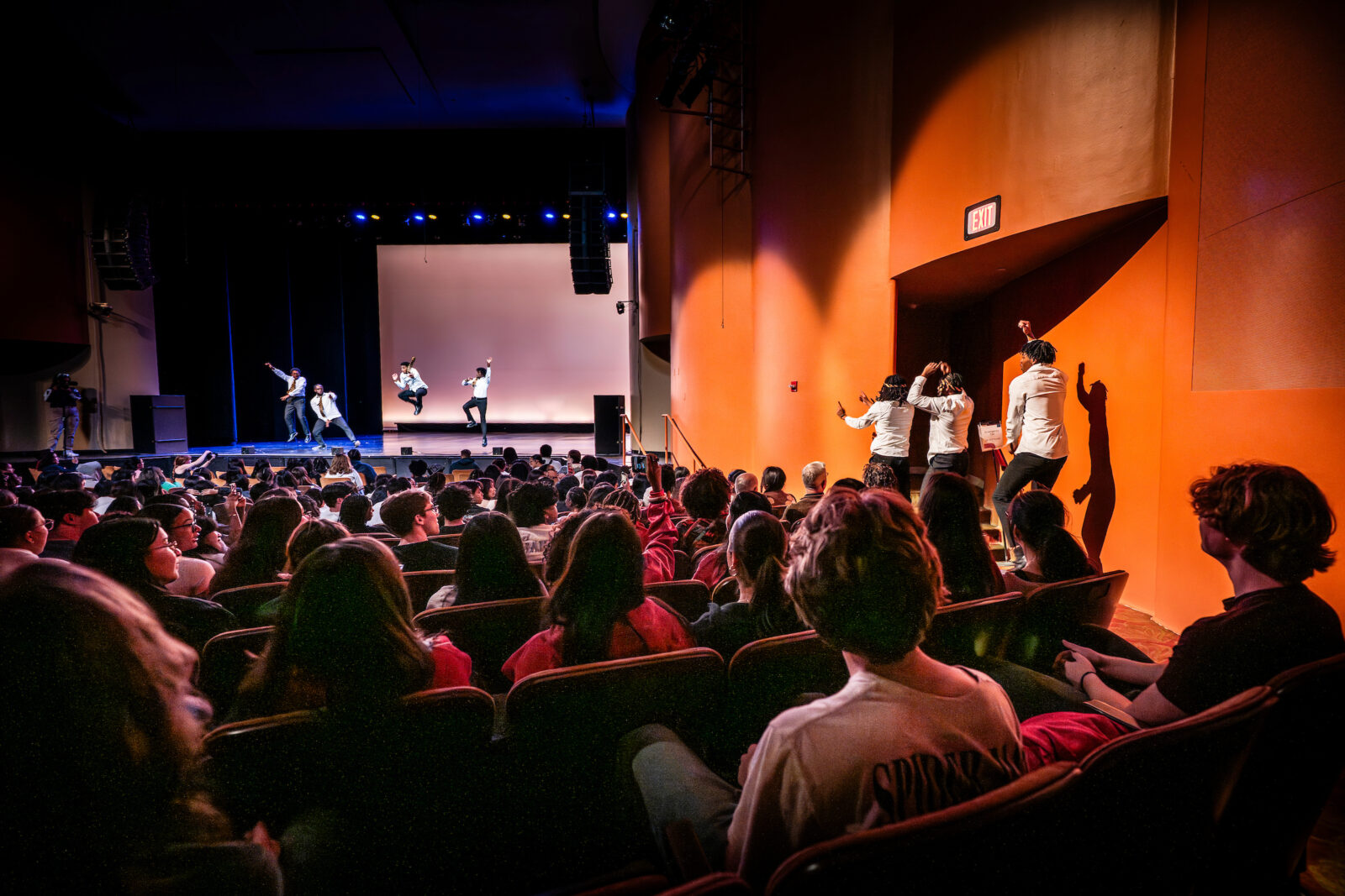 Members of Alpha Phi Alpha Fraternity, Inc. perform for a large crowd during the Multicultural Orientation and Reception (MCOR): Cultural Showcase in Shannon Hall in the Memorial Union