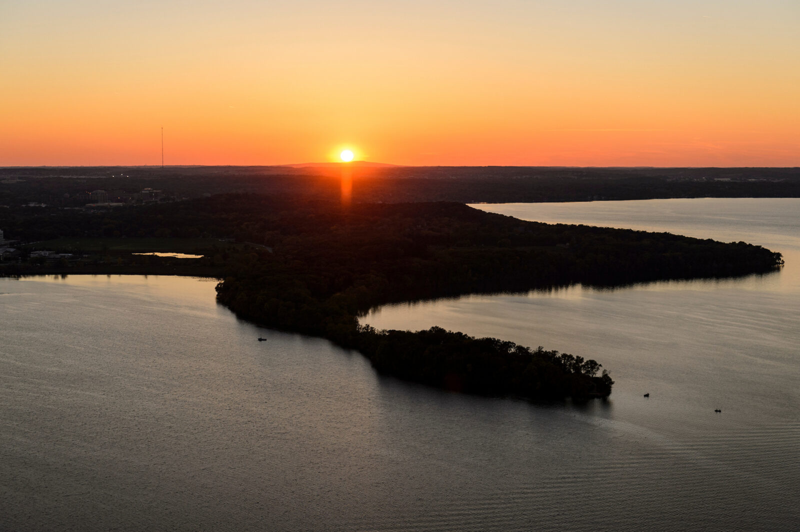 Lake Mendota and Picnic Point on the University of Wisconsin-Madison campus are pictured in a sunset aerial