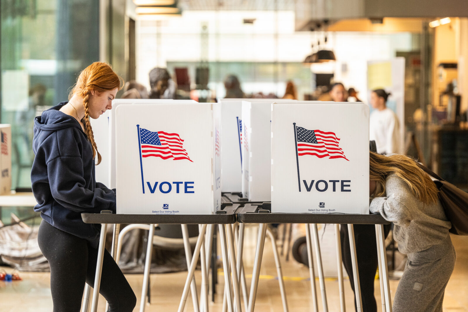 Students at the University of Wisconsin-Madison, including Lily Martin (left), exercise their civic right to vote inside the Chazen Museum of Art polling location during the 2024 Presidential Election on Nov. 5, 2024. (Photo by Bryce Richter / UW–Madison)