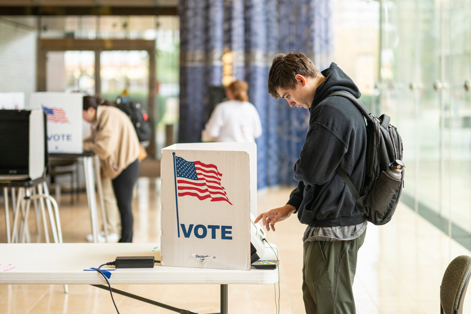 Students at the University of Wisconsin-Madison, including Drew Broch, exercise their civic right to vote inside the Chazen Museum of Art polling location during the 2024 Presidential Election on Nov. 5, 2024. (Photo by Bryce Richter / UW–Madison)
