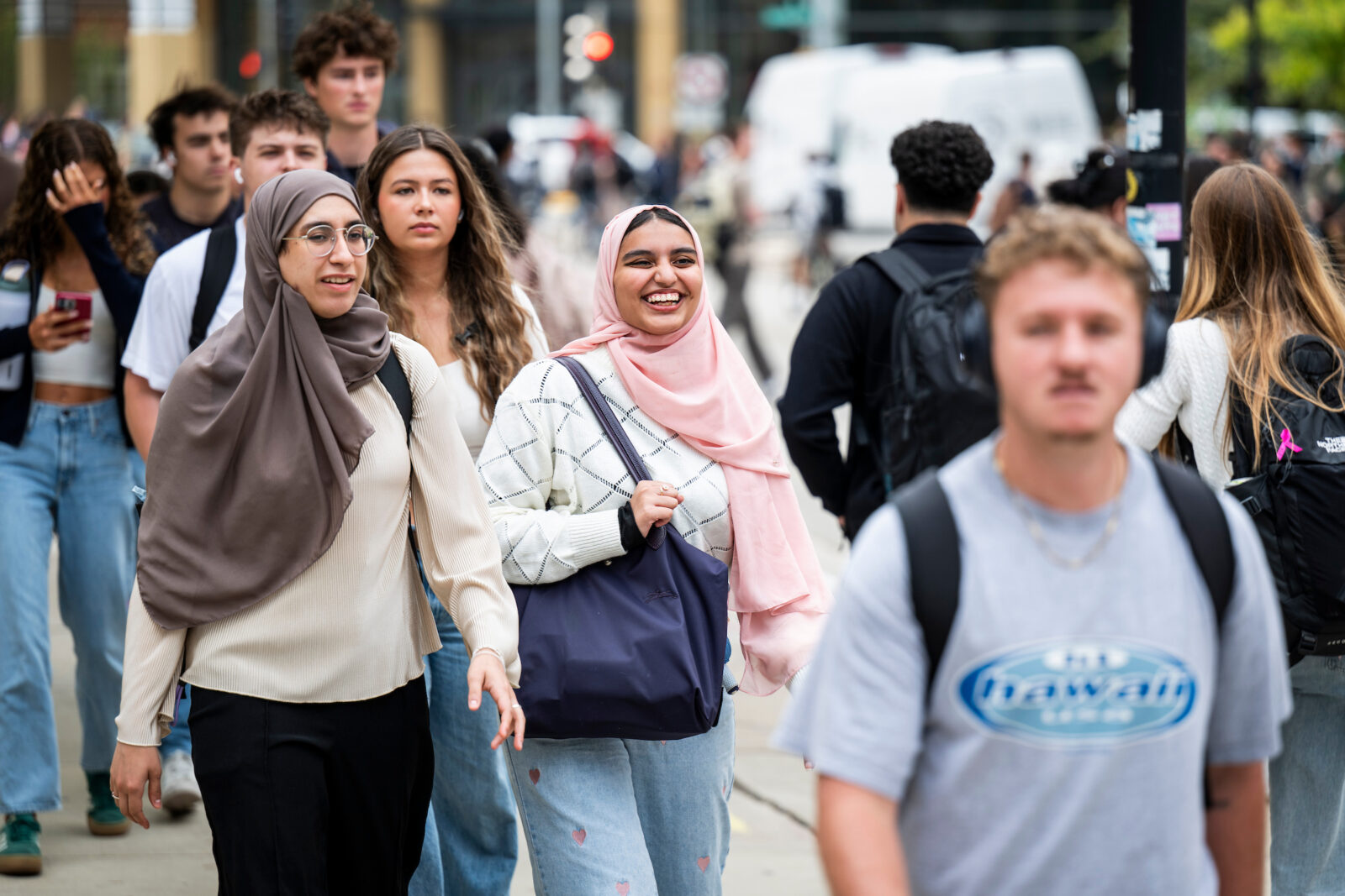 Rolla Al Hanaya (left), a fourth-year international student from Saudi Arabia studying data science walks up the stairs on Bascom Hill to Van Vleck Hall with Eman Saegh, a first-year international student from Saudi Arabia studying chemical engineering, during passing period on the first day of the fall semester at the University of Wisconsin–Madison on Sept. 3, 2025. (Photo by Taylor Wolfram / UW–Madison)