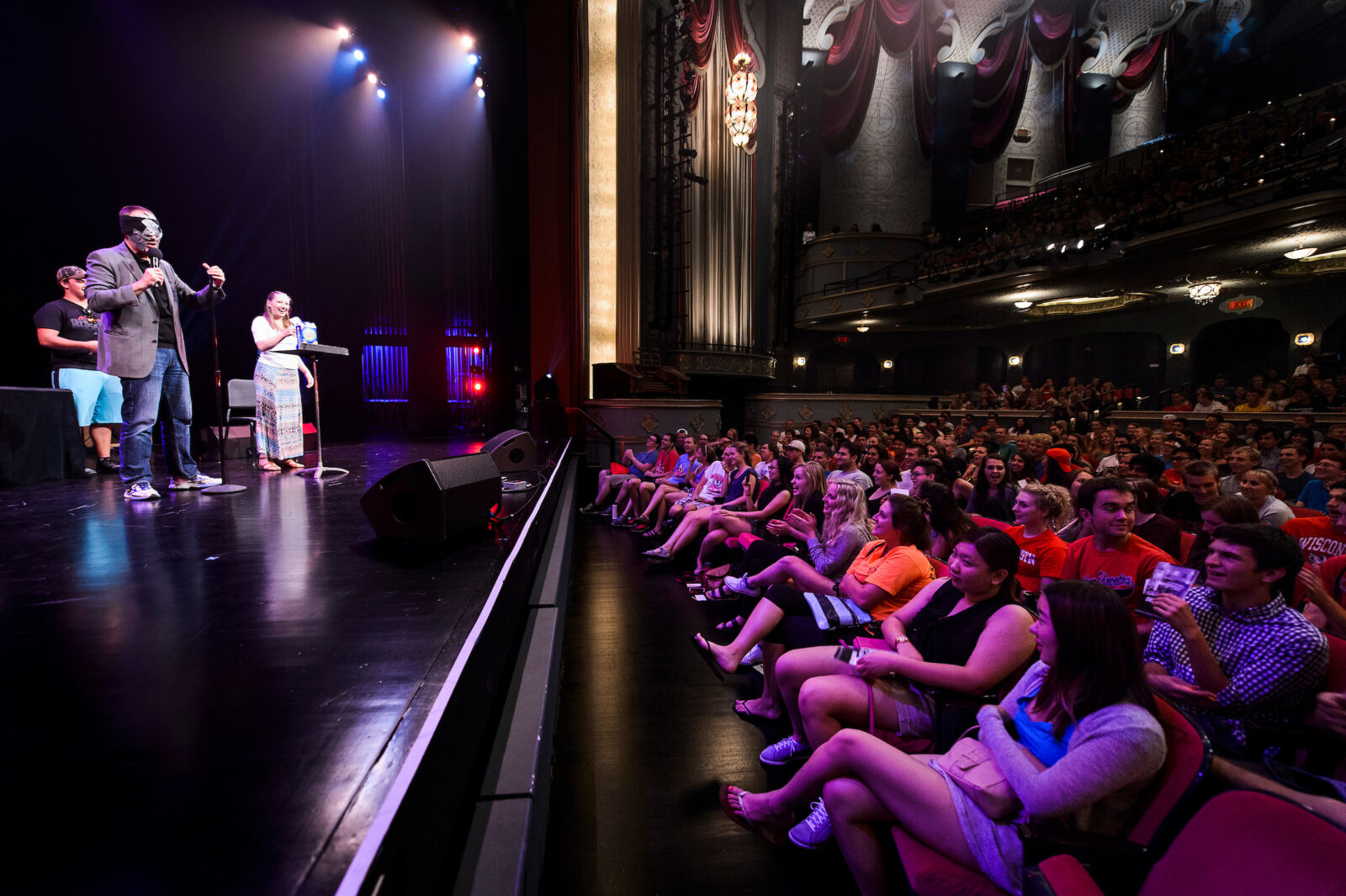 During a Wisconsin Welcome event dubbed First Night at the Overture, University of Wisconsin-Madison students watch blind-folded and duct-taped mentalist Chris Carter identifies objects collected by audience volunteers Ethan Heroux and Tina Bouril during a show at the Capitol Theater at the Overture Center for the Arts in downtown Madison on Sept. 4, 2015. Throughout the evening, several thousand freshmen and transfer students filled multiple spaces at Overture and enjoyed a variety of arts, comedy, dance and music performances, plus socializing with new friends. The event is organized by the Center for the First-Year Experience (CFYE). (Photo by Jeff Miller/UW-Madison)