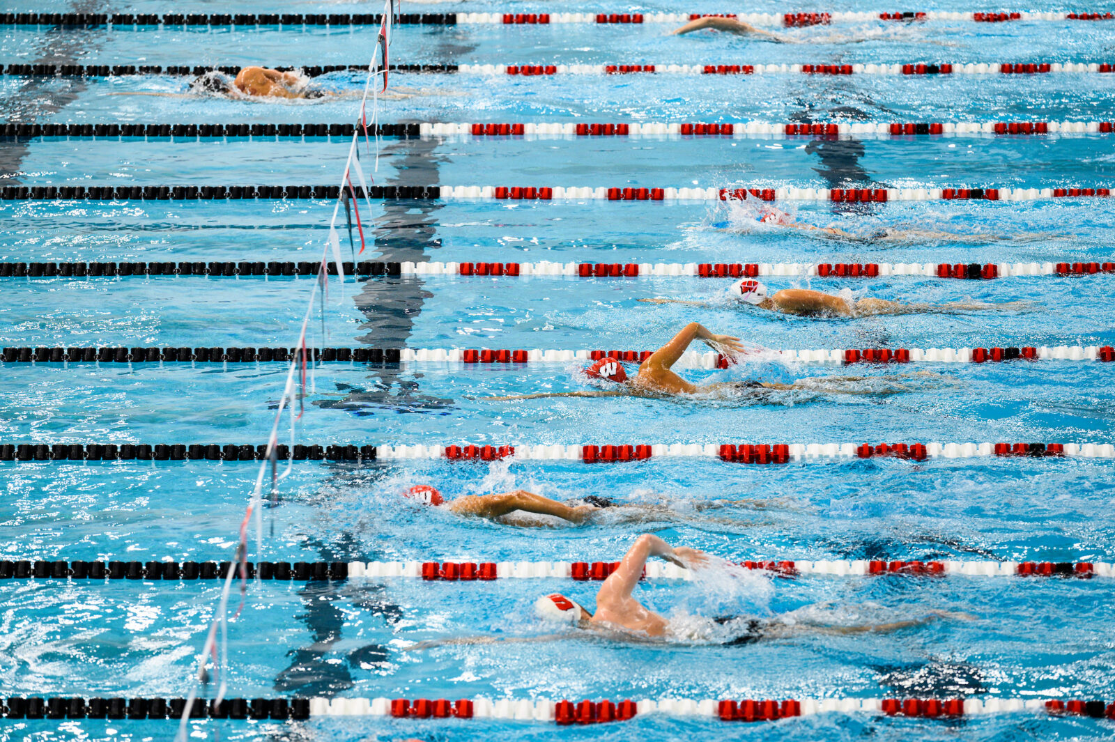 Members of the UW swim team meet for practice in the pool in the Soderholm Family Aquatic Center in the Nicholas Recreation Center, a University of Wisconsin-Madison exercise and fitness facility nicknamed “the Nick,” on Oct. 14, 2020. (Photo by Jeff Miller / UW-Madison)