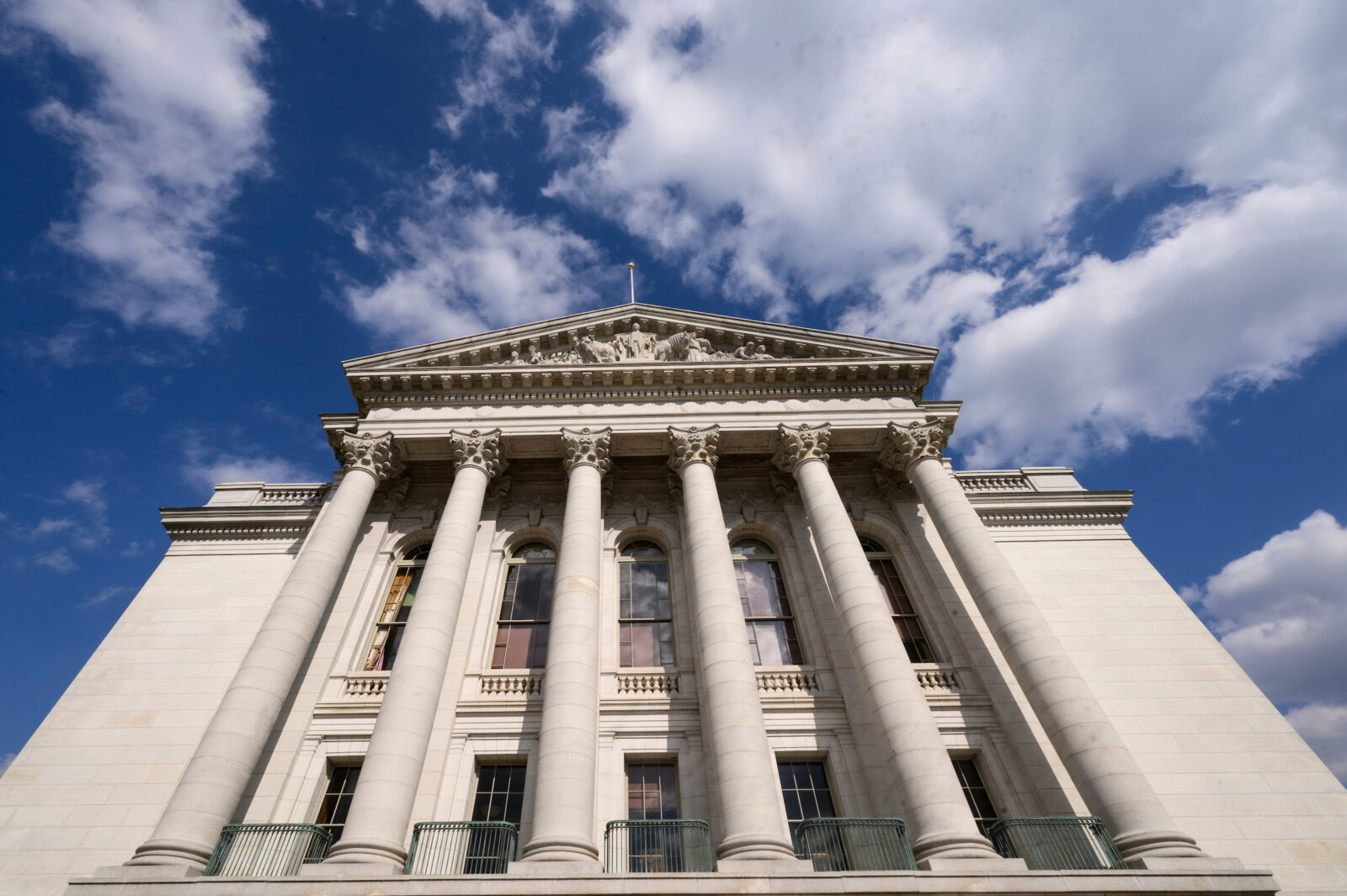 The Wisconsin State Capitol rises up into a blue sky during the UW–Madison's Day at the Capitol, a University of Wisconsin–Madison advocacy and outreach event held for legislators and staff at the Wisconsin State Capitol on April 26, 2023, sponsored by the Wisconsin Alumni Association. The outreach event included a Graduate Research Showcase held in the Wisconsin State Capitol rotunda and Faculty Flash Talks by leading UW–Madison faculty researchers held in the Capitol’s 411 South. (Photo by Althea Dotzour / UW–Madison)