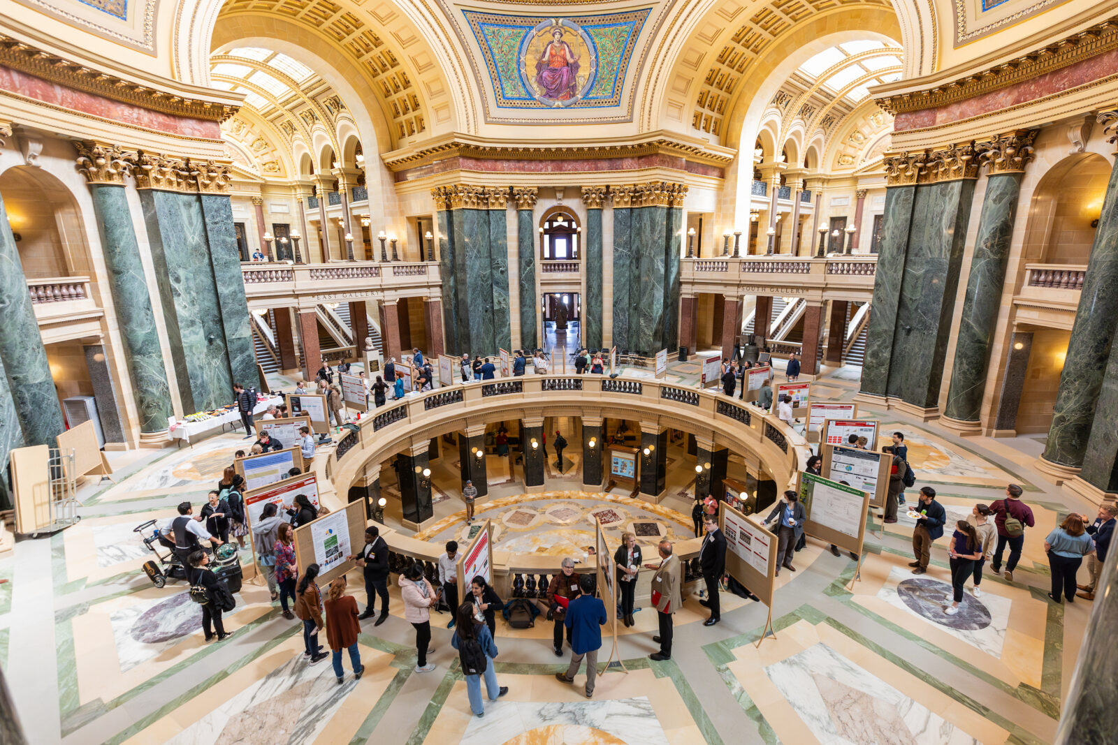The Wisconsin State Capitol rises up into a blue sky during the UW–Madison's Day at the Capitol, a University of Wisconsin–Madison advocacy and outreach event held for legislators and staff at the Wisconsin State Capitol on April 26, 2023, sponsored by the Wisconsin Alumni Association. The outreach event included a Graduate Research Showcase held in the Wisconsin State Capitol rotunda and Faculty Flash Talks by leading UW–Madison faculty researchers held in the Capitol’s 411 South. (Photo by Althea Dotzour / UW–Madison)