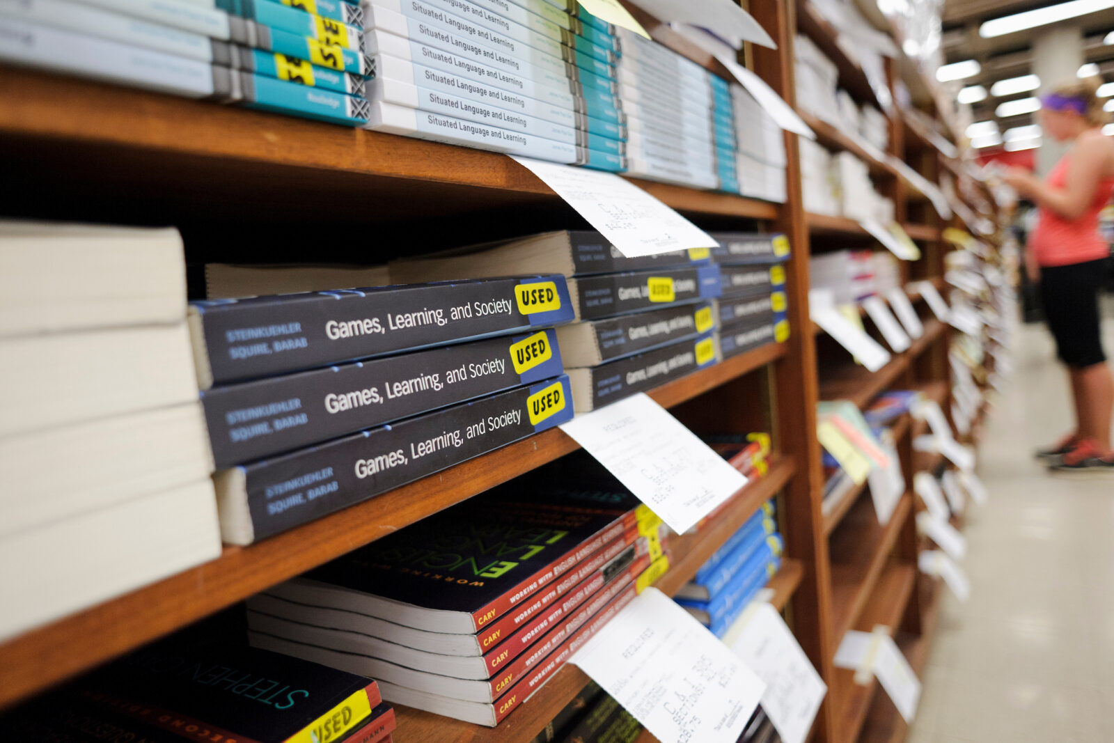 Students search for used and new textbooks to buy at the University Book Store on the University of Wisconsin-Madison campus on Sept. 1, 2013. (Photo by Jeff Miller/UW-Madison)